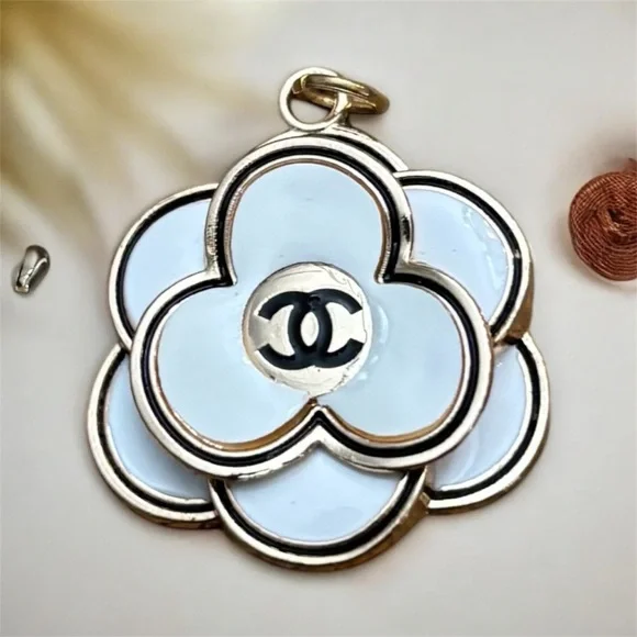 CHANEL White and Gold Camellia Charm - Picture 1 of 3